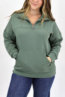 Model wearing full length weekender 1/4 zip in sage. Cloud material with fleece lined.