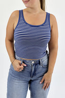 Model wearing The Striped Micro Ribbed Tank in navy base with white stripes.