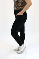 model wearing AJ Tummy Control Leggings with new extended panel and side pocket detail.