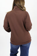 Model wearing full length weekender 1/4 zip in brown. Cloud material with fleece lined.