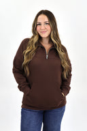 Model wearing full length weekender 1/4 zip in brown. Cloud material with fleece lined.