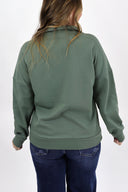 Model wearing full length weekender 1/4 zip in sage. Cloud material with fleece lined.