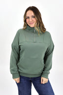 Model wearing full length weekender 1/4 zip in sage. Cloud material with fleece lined.