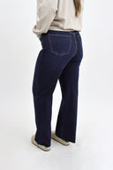 Model wearing Tummy Control Wide Leg dark wash in our 40" inseam cut to length.