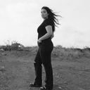 Black and White photo of model standing in desert wearing Tummy Control Wide Leg Jean - Black Distressed Wash