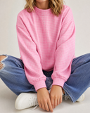 Women sitting wearing the AJ Cloud Mockneck in pink gingham pattern