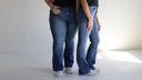 2 models, petite and plus-size wearing the Everyday Flare Jeans with Tummy Control. Text reads, "Denim that fits like it should."