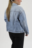 Model wearing RFM Boyfriend Denim Jacket showing the back of jacket.