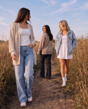 3 women walking outside on trail wearing 3 different AJ Fall layered outfits. Banner to click into for fall favorites collection.