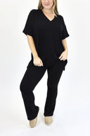 Model wearing Ribbed Flare Set by AJ in black color.