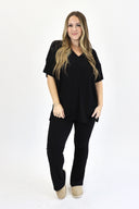 Model wearing Ribbed Flare Set by AJ in black color.