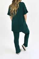 Model wearing Ribbed Flare Set by AJ in evergreen color. ( back view)