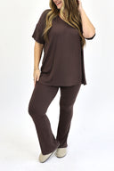 Model wearing Ribbed Flare Set by AJ in raisin color.