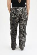 Back shot of model wearing RFM tummy control wide leg jeans in leopard wash
