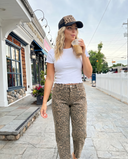 Women drinking coffee walking down the street wearing AJ's Tummy Control Barrel Jeans - Leopard Wash and a white Baby Lettuce Tee- BLT.