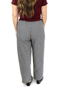 model wearing AJ Linen Barrel Pants in black gingham print.