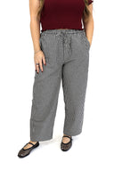 model wearing AJ Linen Barrel Pants in black gingham print.