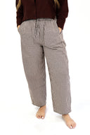 model wearing AJ Linen Barrel Pants in brown gingham print.
