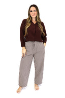 model wearing AJ Linen Barrel Pants in brown gingham print.
