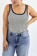 Model wearing The Striped Micro Ribbed Tank in white base with black stripes.