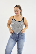 Model wearing The Striped Micro Ribbed Tank in white base with black stripes.