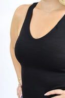 model wearing Open Back Tank in black ribbed material. detail of ribbed material