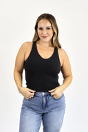 model wearing Open Back Tank in black ribbed material. 