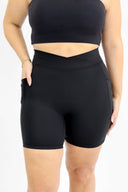 model wearing AJ Tummy Control Crossover Biker Shorts with 6" inseam in black
