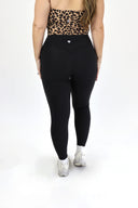 model wearing AJ Tummy Control Leggings with new extended panel and side pocket detail.