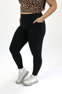 model wearing AJ Tummy Control Leggings with new extended panel and side pocket detail.