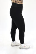model wearing AJ Tummy Control Leggings with new extended panel and side pocket detail.
