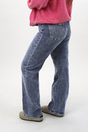 Model wearing Tummy Control Wide Leg Jeans by RFM - acid wash