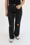 Model wearing Tummy Control Wide Leg Jeans by RFM in Vintage Black Distressed. Regular Inseam