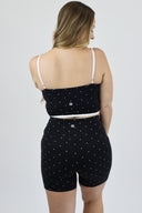Model wearing Contour Tank with black and white micro polka dots back shot.