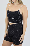 Model wearing Contour Tank with black and white micro polka dots front angled shot.